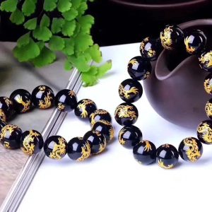 Bracelet mala en pierre d'agate noire motif dragon