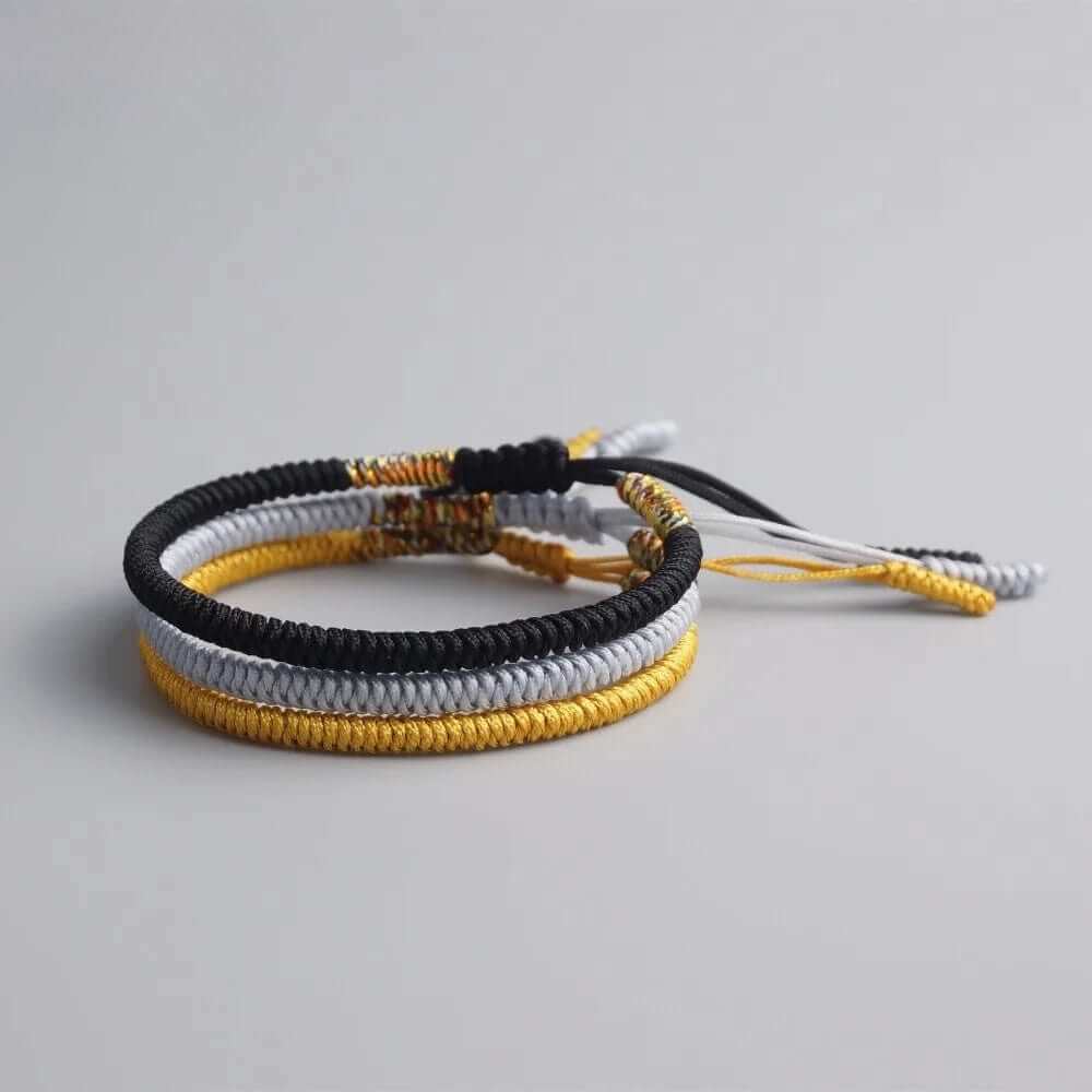 Bracelet tibétain tressé à la main noir, or et gris