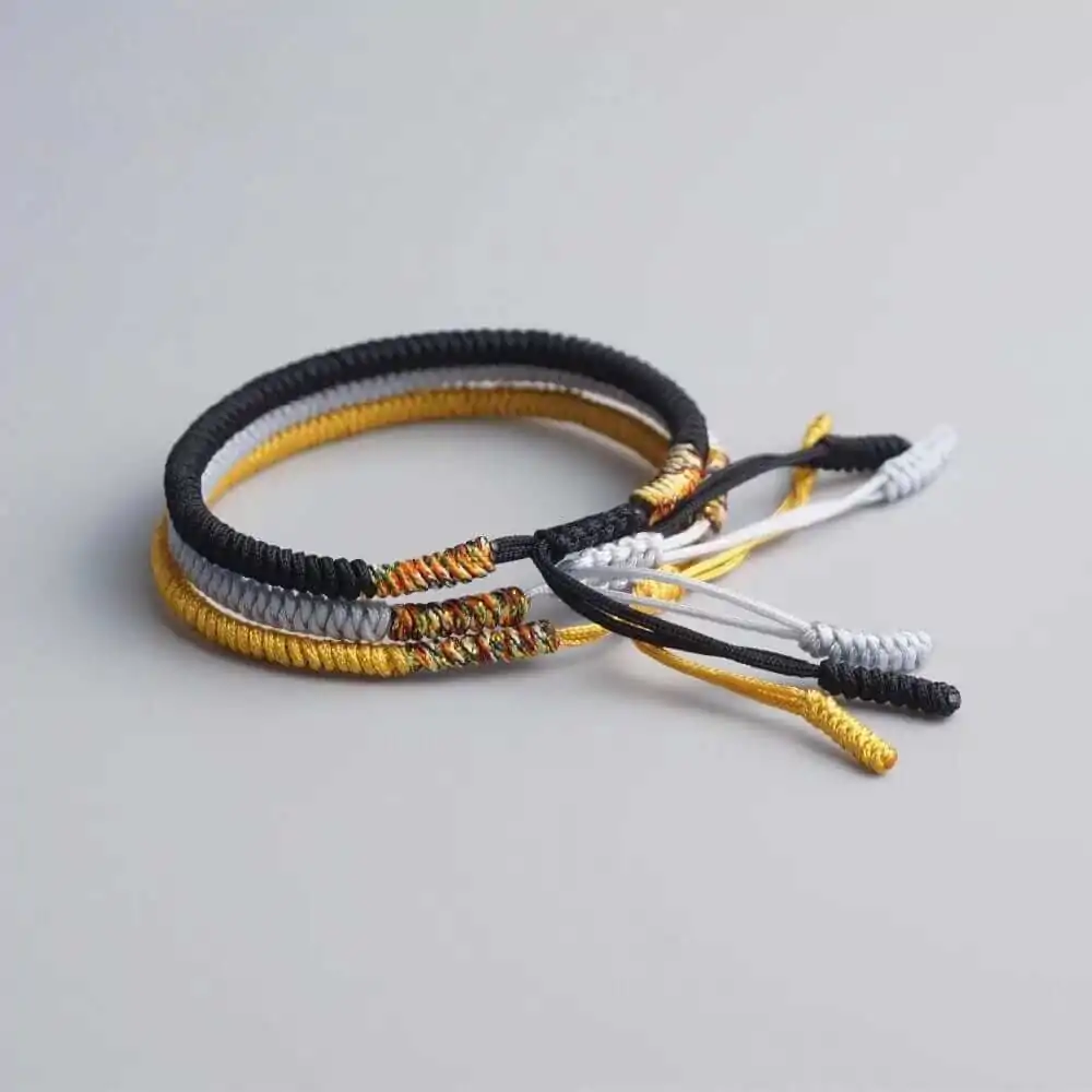 Bracelet tibétain tressé à la main noir, or et gris