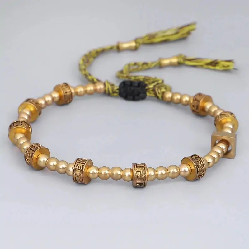 Bracelet tibétain tressé à la main avec perles en cuivre