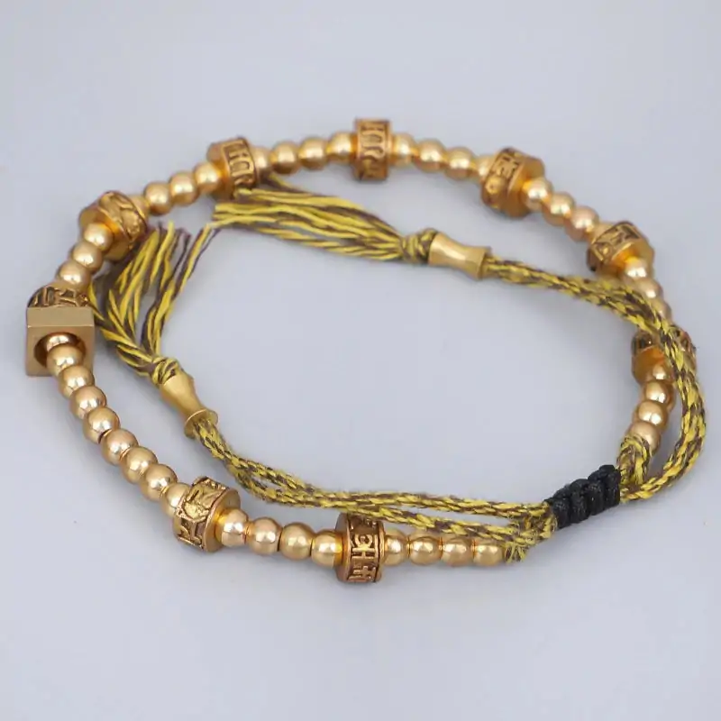 Bracelet tibétain tressé à la main avec perles en cuivre