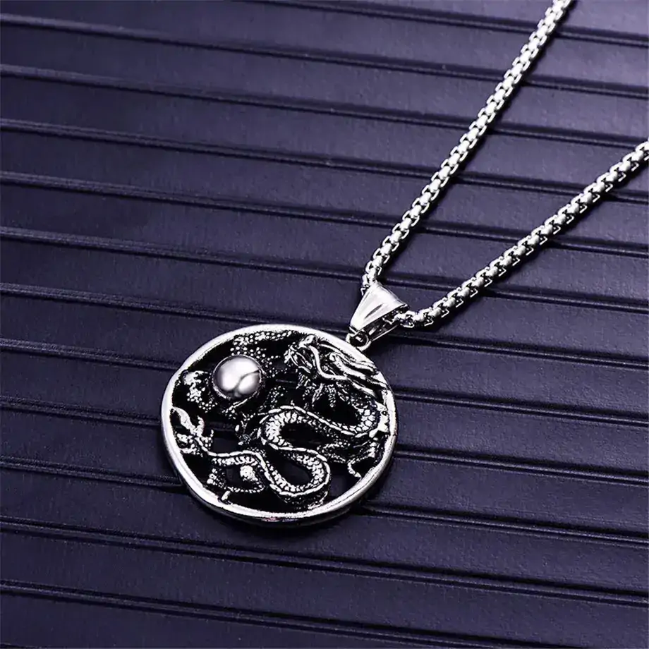 pendentifs amulettes pendentif rond dragon acier inoxy