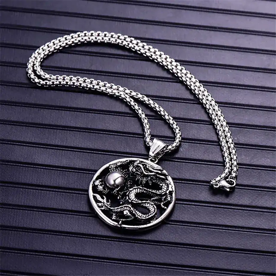 pendentifs amulettes pendentif rond dragon acier inoxy