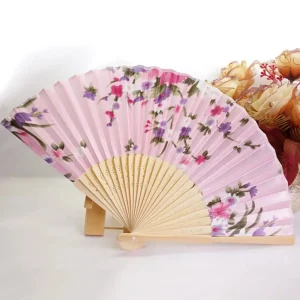 Traditional Chinese silk folding fan, pink background with hot pink peonies and purple asters, bamboo ribs