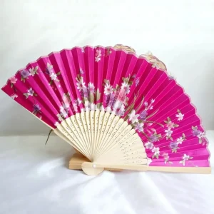 Chinese silk folding fan, fuchsia background with white and lavender cherry blossoms and butterfly motif, bamboo ribs