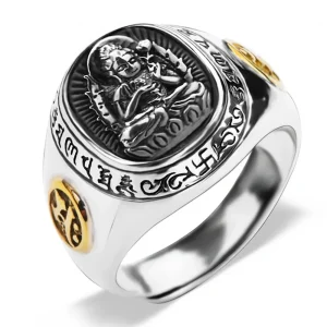 Close-up of Chinese zodiac 925 silver ring face showing Buddhist guardian deity engraved in high relief with gold accent coins