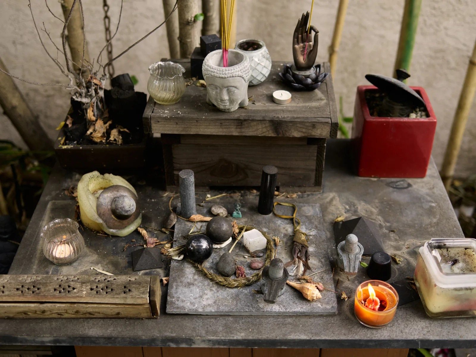 Contemporary Buddhist meditation altar combining traditional statue with modern minimal aesthetic