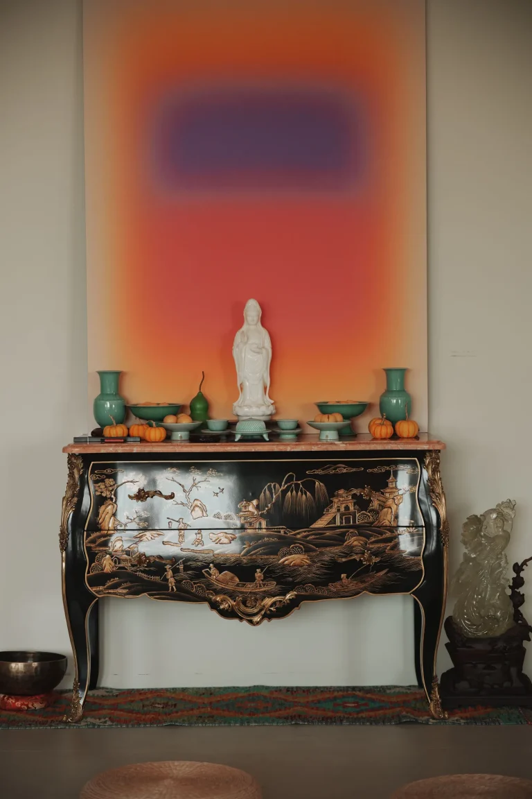 Guanyin Bodhisattva home altar with incense, offerings, and candles — Chinese Buddhist tradition