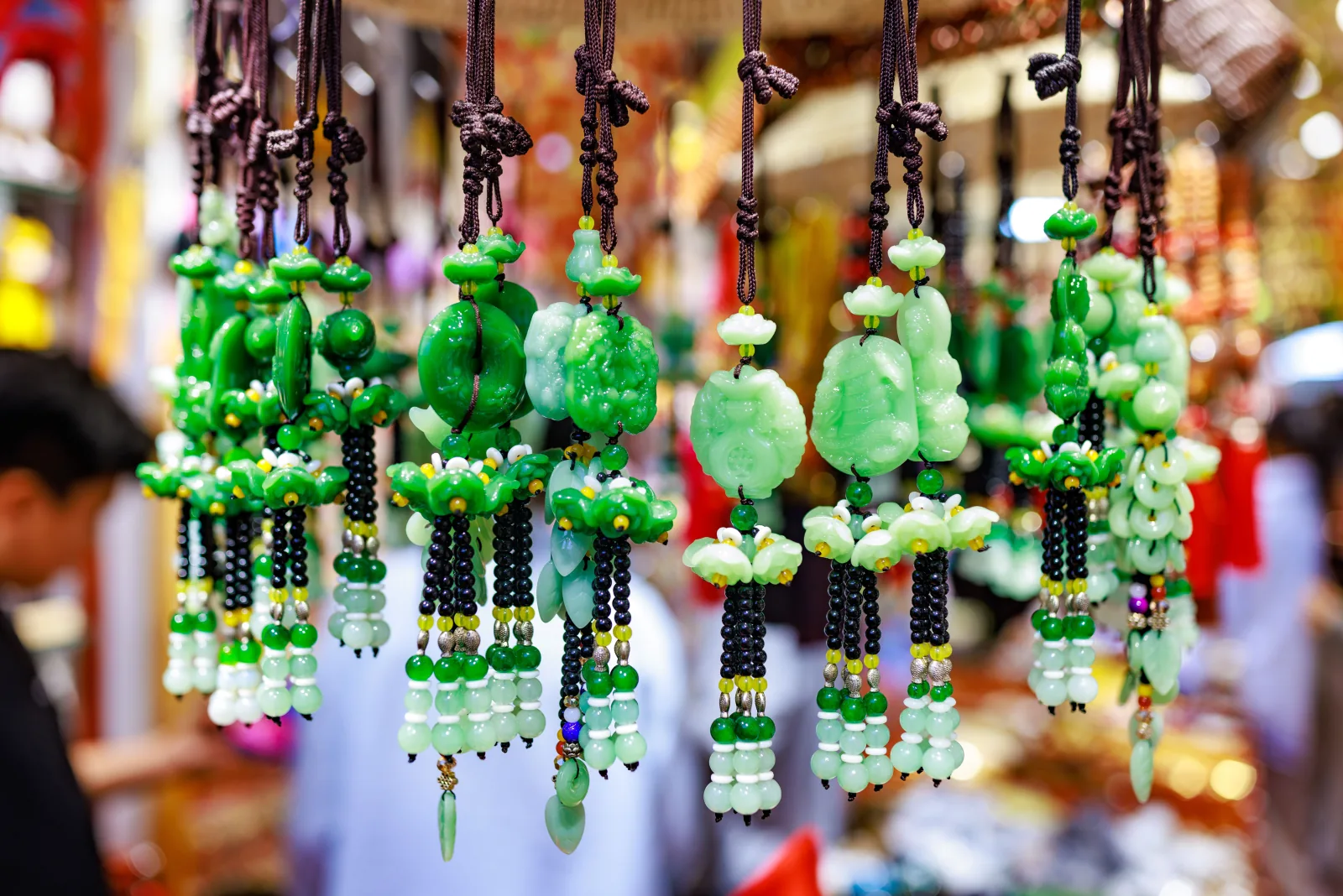 Hand-carved jade charms and amulets — nephrite stone, traditional Chinese protective symbols