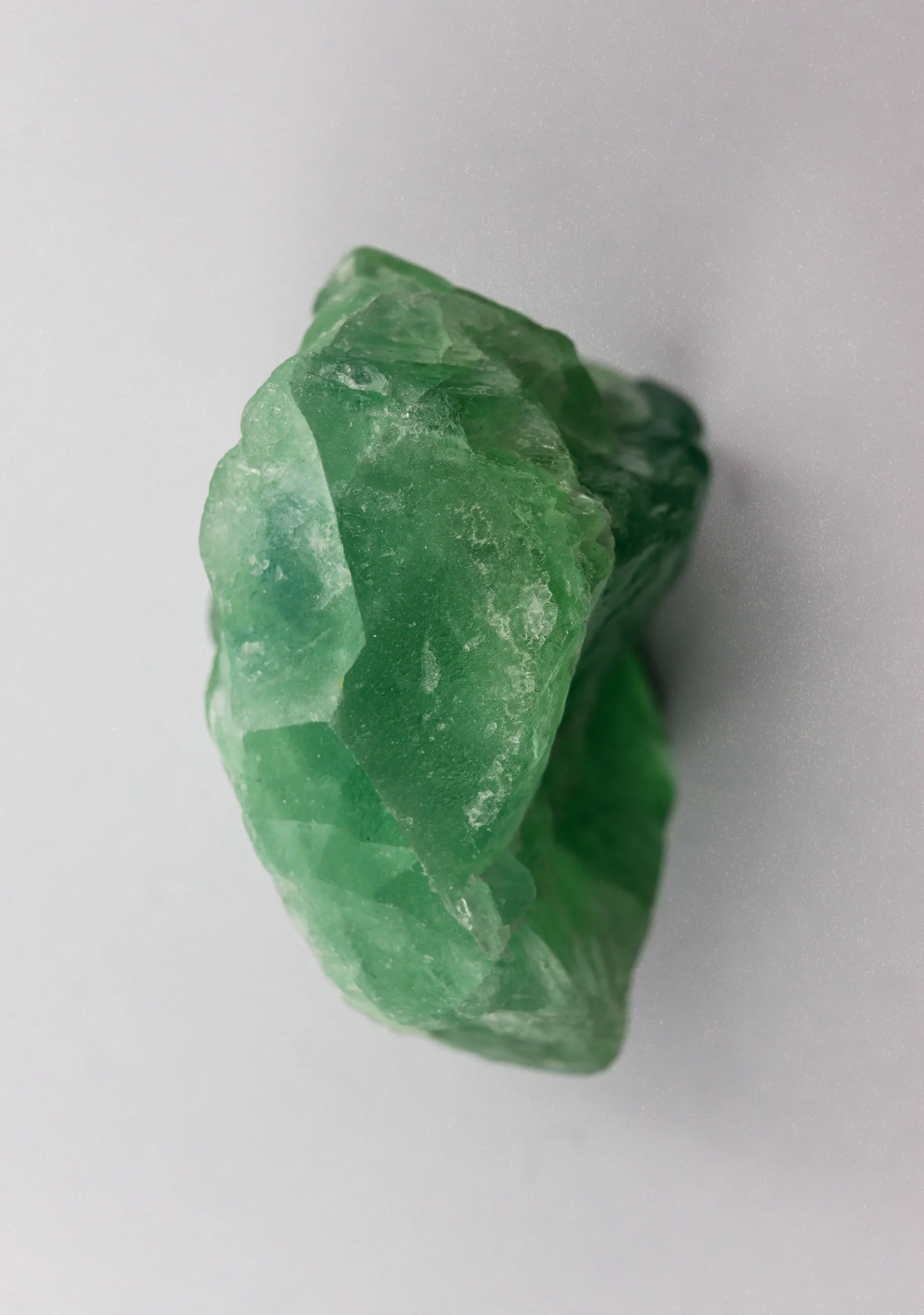 Polished jade pieces showing characteristic translucent green and white veining — nephrite variety