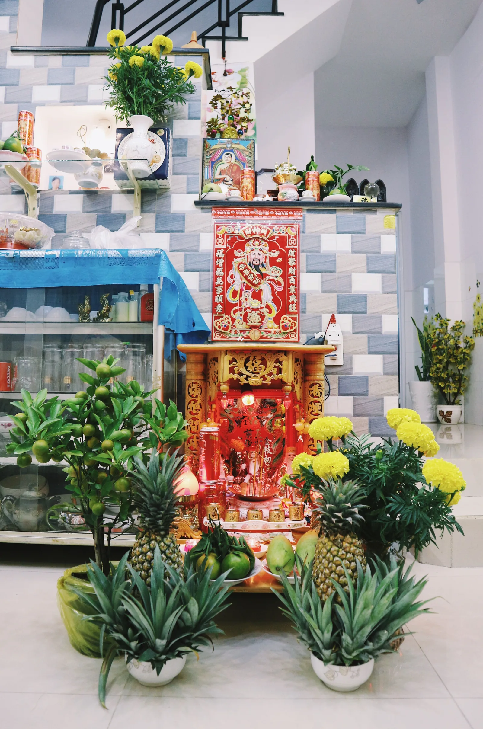Vietnamese home altar with ancestor offerings, incense and fruit — family worship tradition